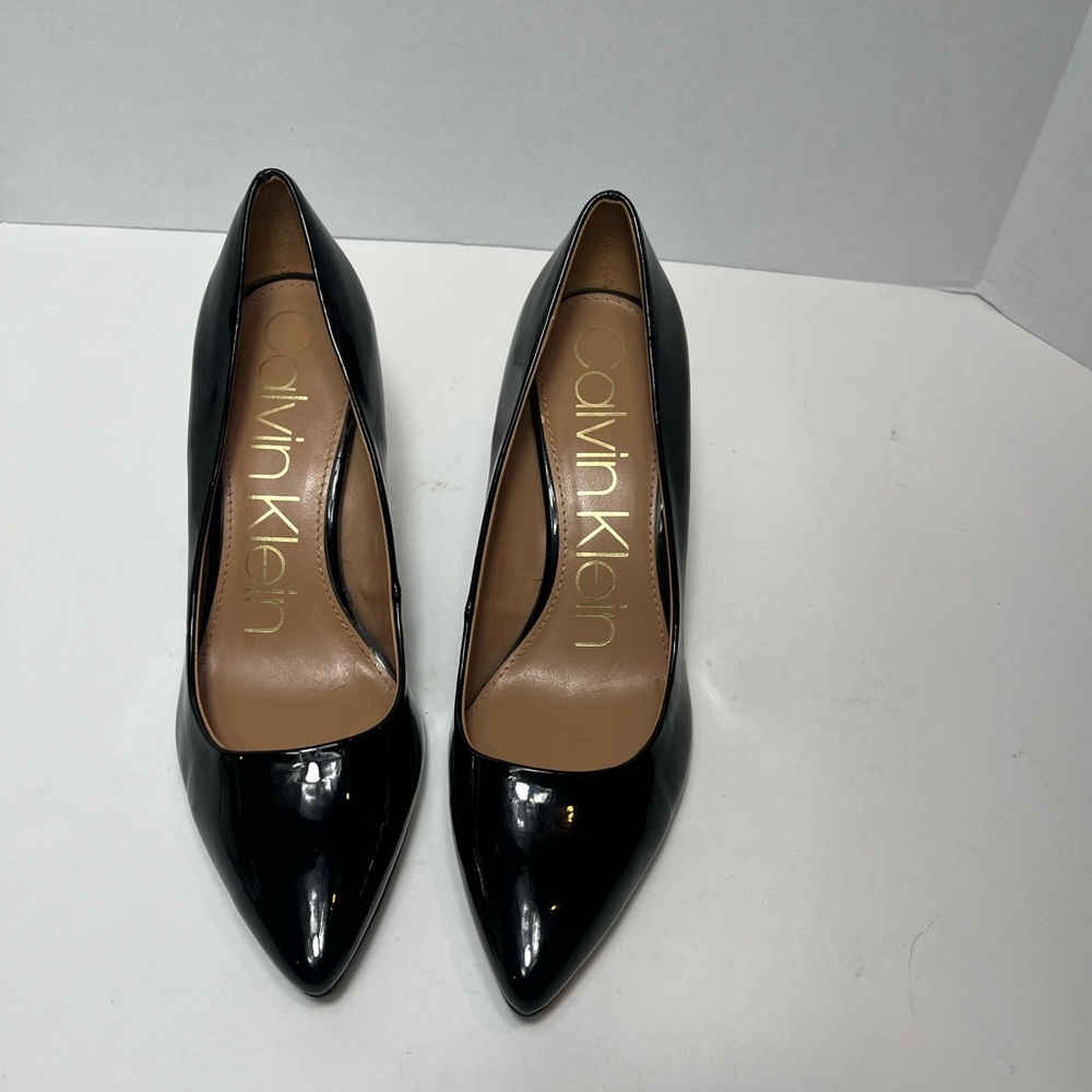 Women’s Calvin Klein black patent leather pump heels. Size 8 3”